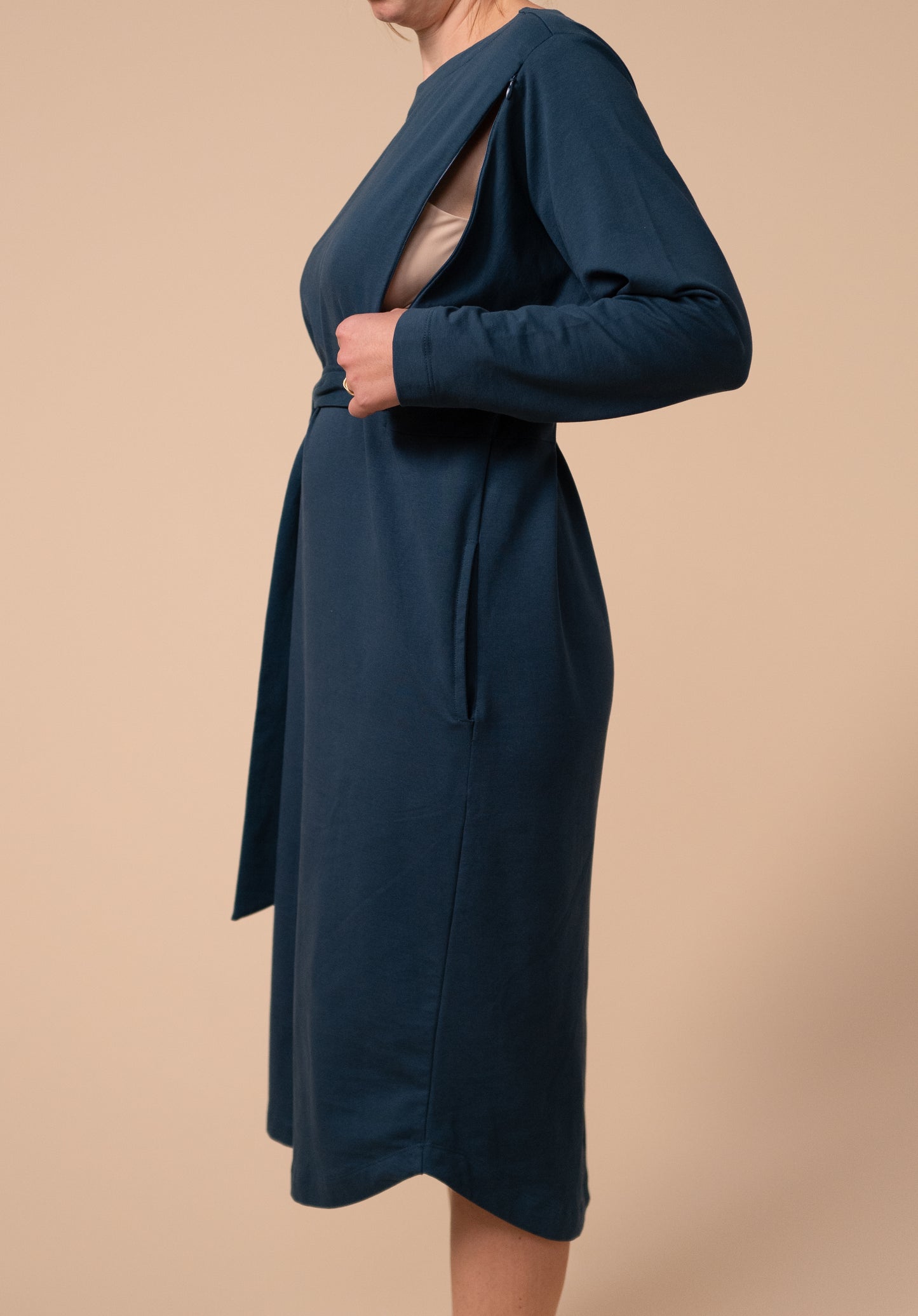 Side view showing the breastfeeding access on the drape tie dress