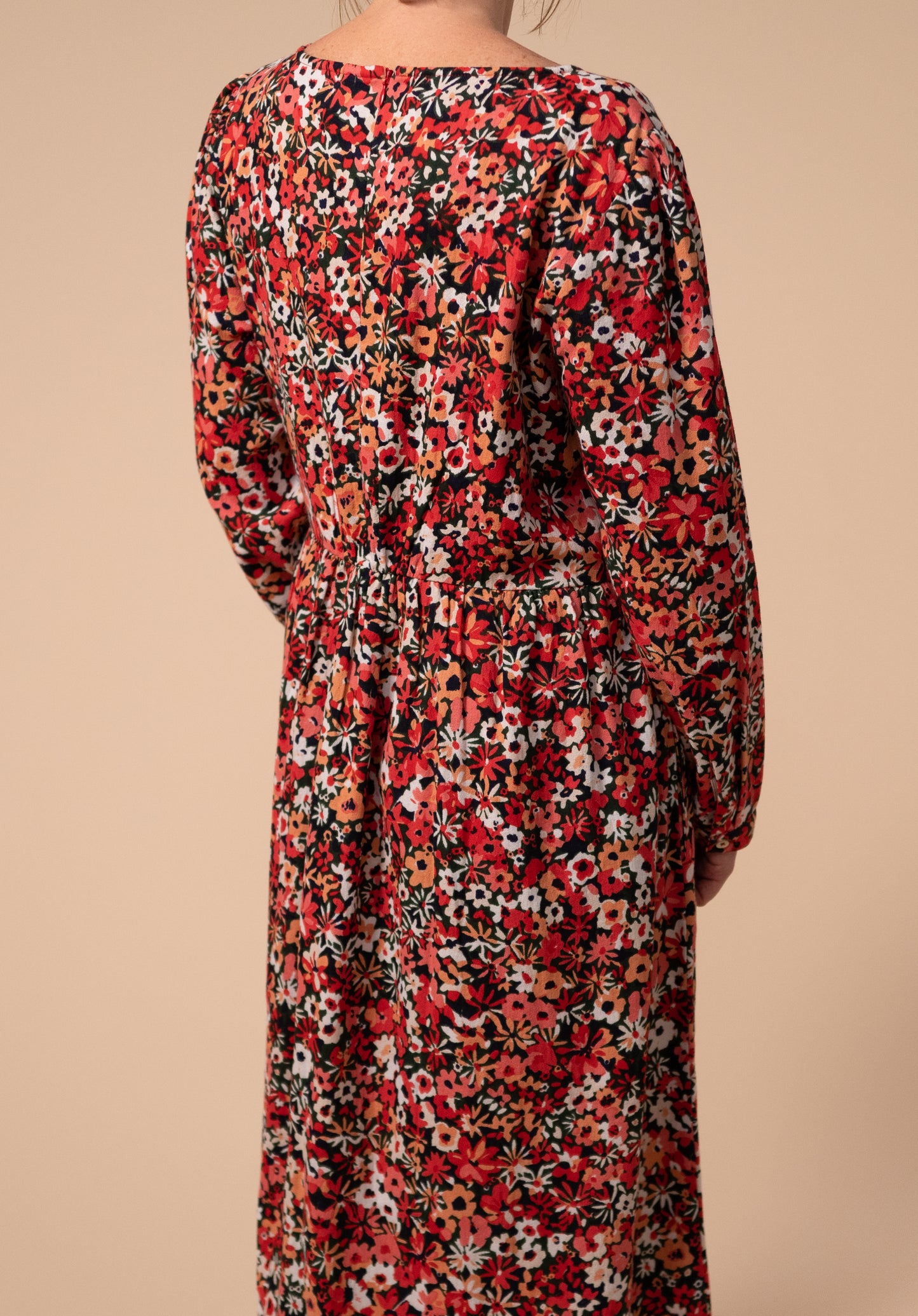 The back detail which is gathered with stretch of our Martha floral nursing dress