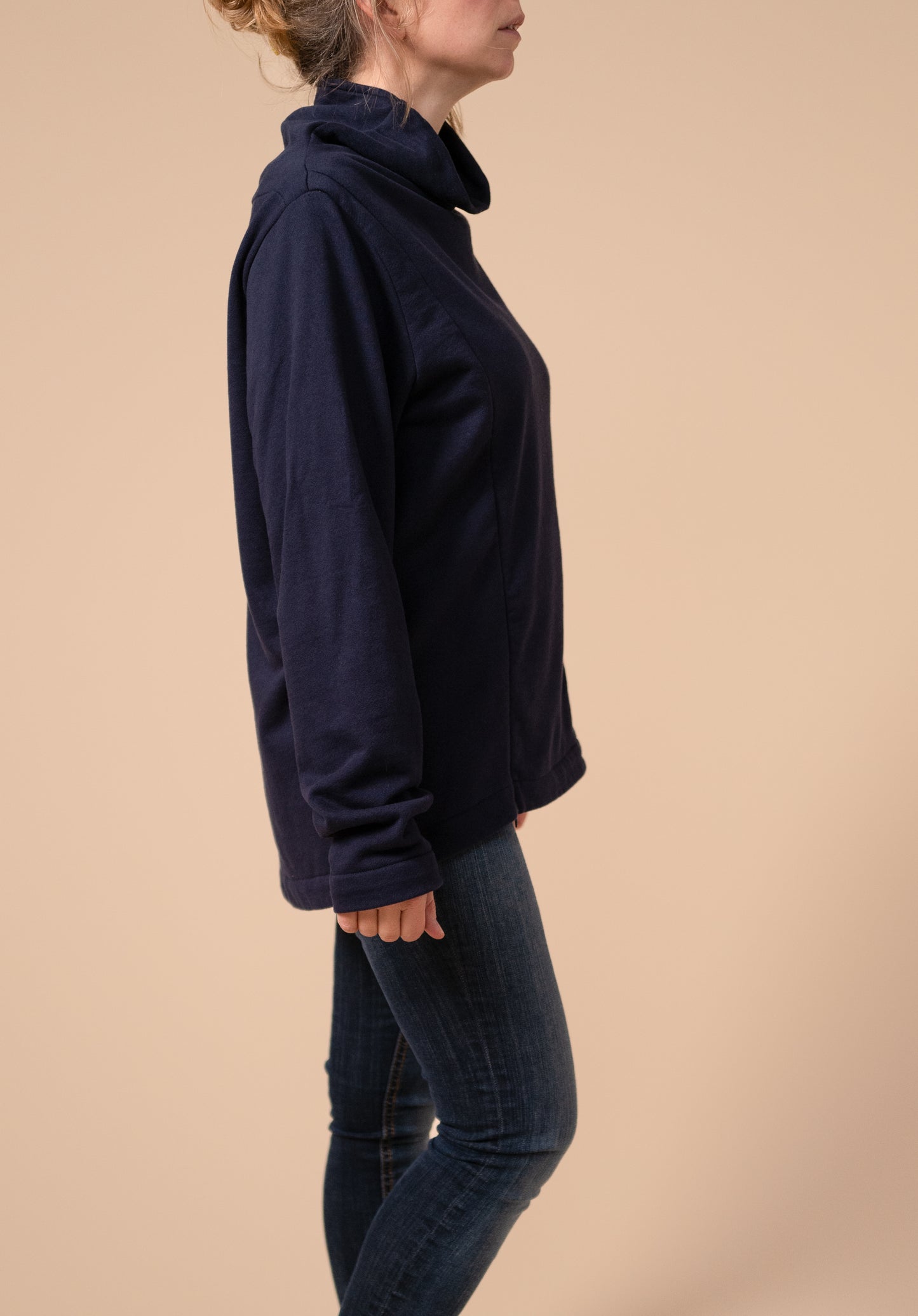 Side view of the drape neck nursing jumper