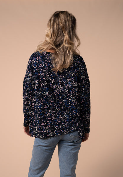 Confetti style print nursing top with dropped sleeves and zip access. close-up of back detail.